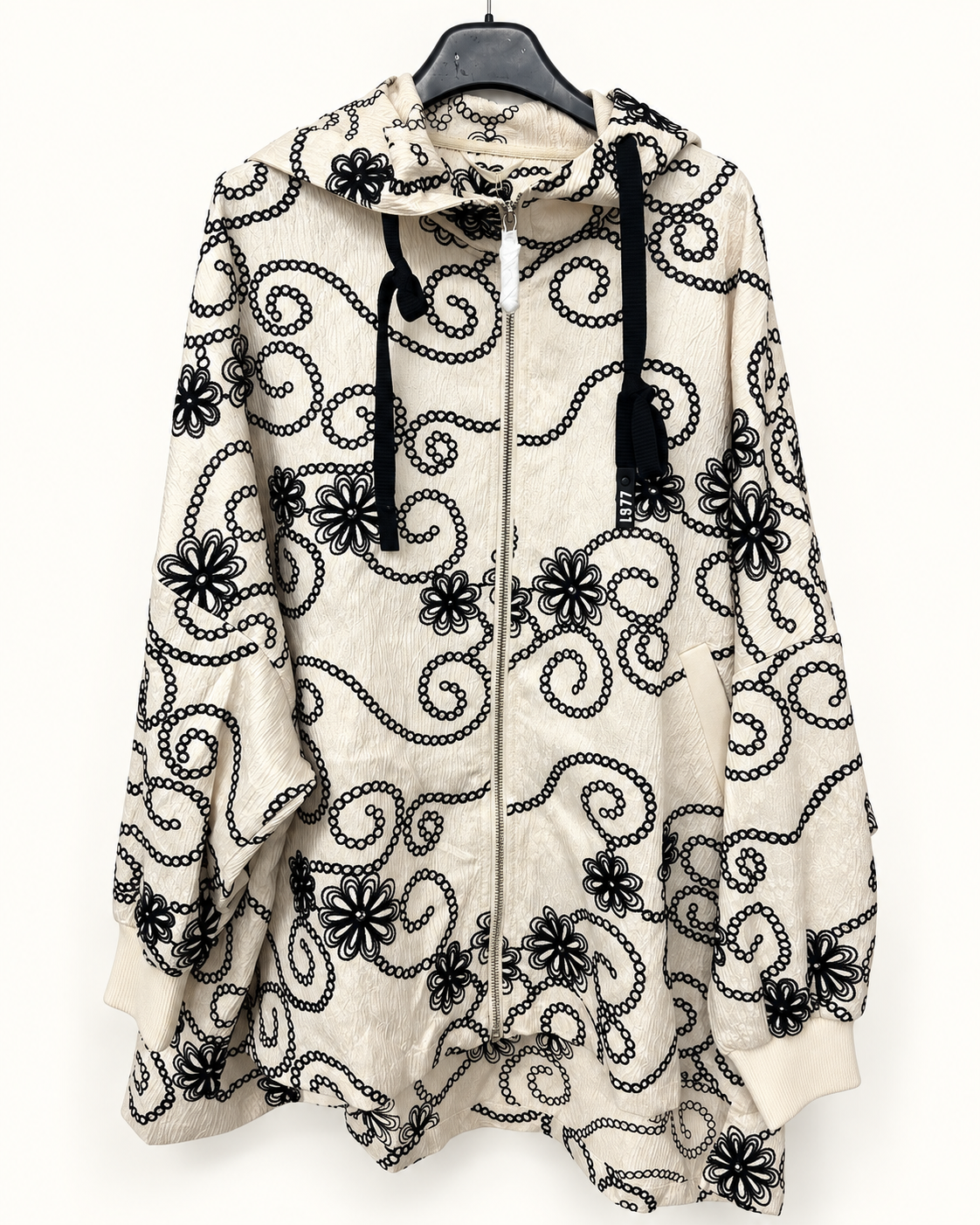 Giacca con cappuccio a fiori e volute